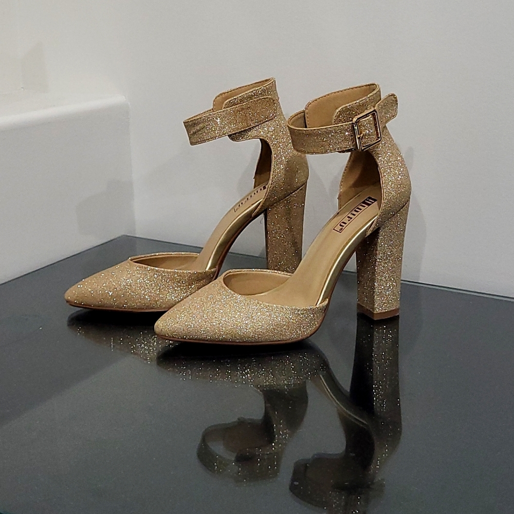 Gold ankle strap high heel shoes